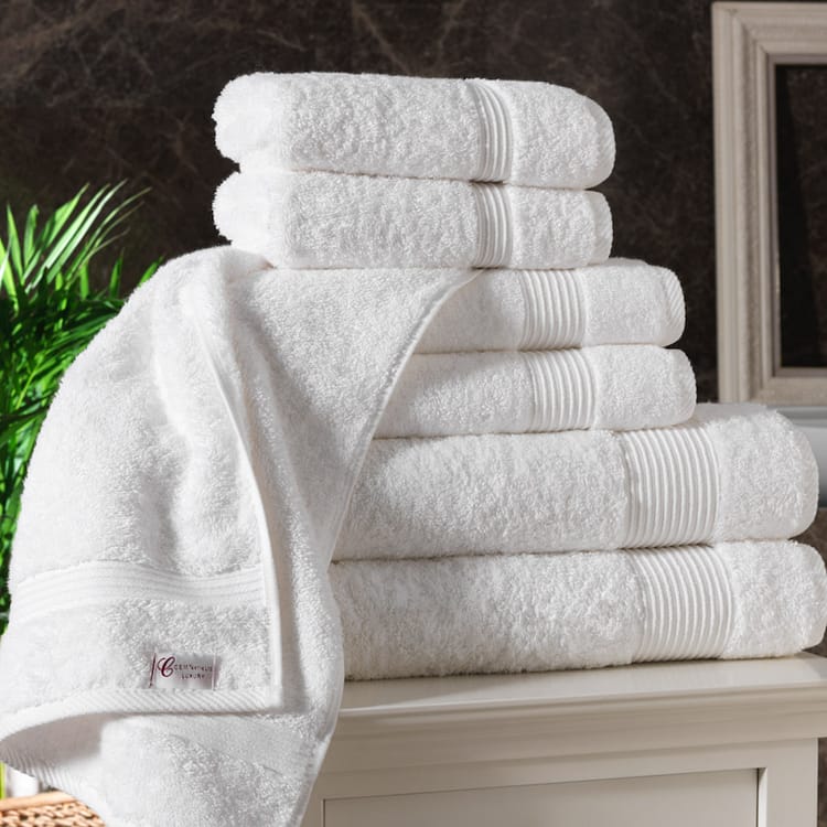 600GSM white hotel towels – folded neatly